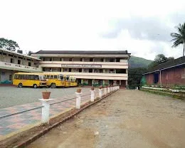School buses parked in front of the main building