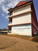 The school signboard on the side of the building